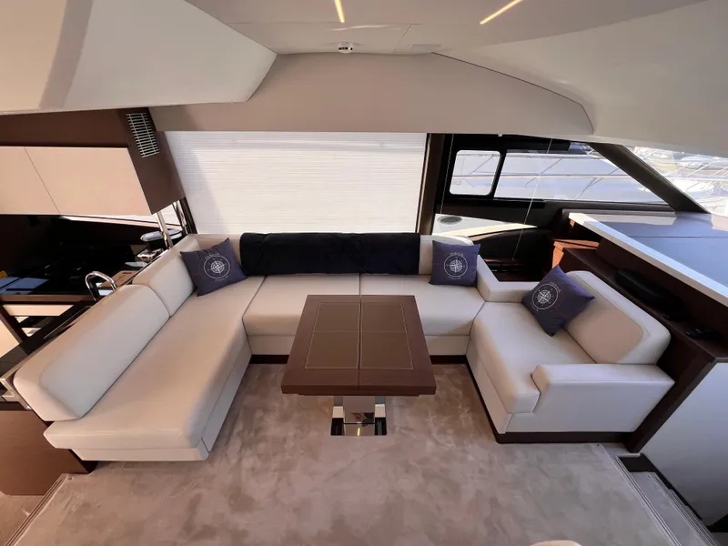 Slide: The Image of Luxurious interior of 2023 Prestige 520 yacht with elegant seating and modern design. - 9
