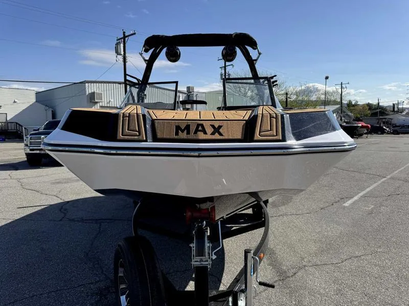Slide: The Image of 2024 Moomba Max boat on trailer, front view in parking lot. - 3