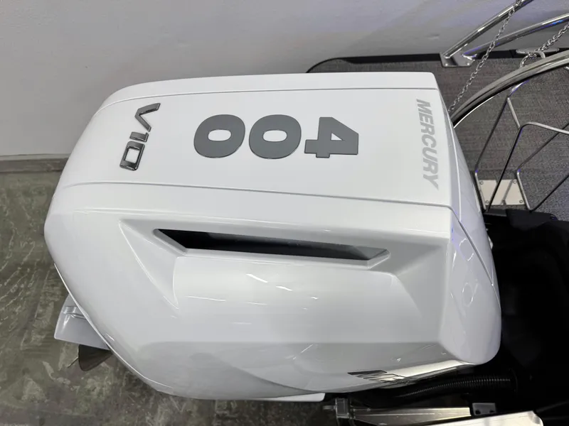 Slide: The Image of Outboard motor on 2025 Barletta Reserve Leggera R26UCA boat, featuring Mercury branding. - 12