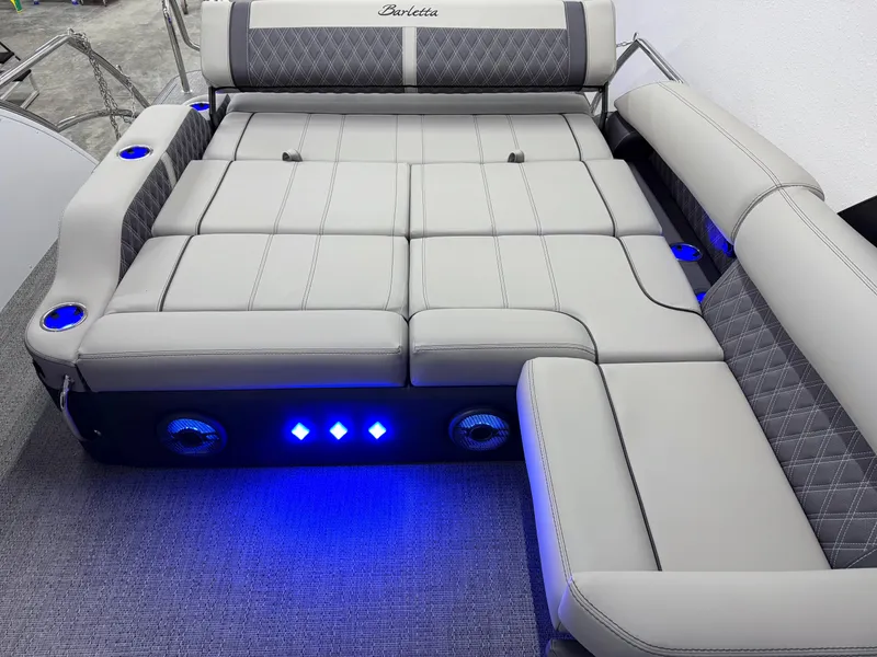 Slide: The Image of 2025 Barletta Reserve Leggera R26UCA boat seating with LED lights and cup holders. - 17