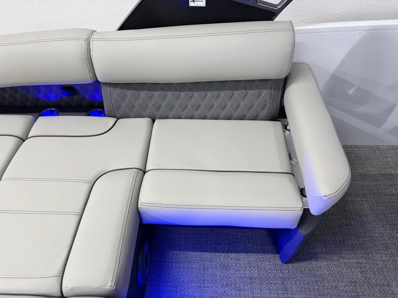Slide: The Image of 2025 Barletta Reserve Leggera R26UCA boat seating with gray upholstery and blue LED lighting. - 24