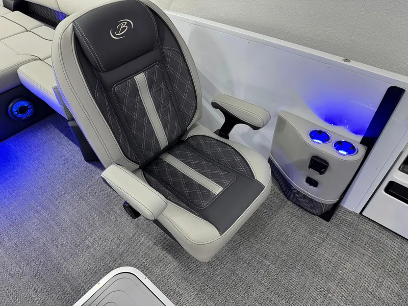 Slide: The Image of 2025 Barletta Reserve Leggera R26UCA boat seat with armrests and illuminated cup holders. - 37