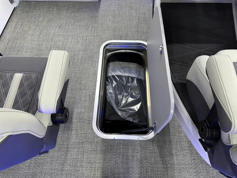 Slide: The Image of 2025 Barletta Reserve Leggera R26UCA interior storage compartment with open lid and seating. - 41