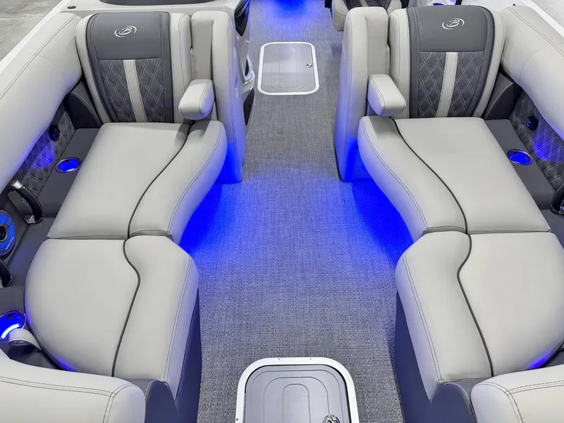 Slide: The Image of Luxurious 2025 Barletta Reserve Leggera R26UCA boat interior with elegant seating and blue LED lighting. - 46