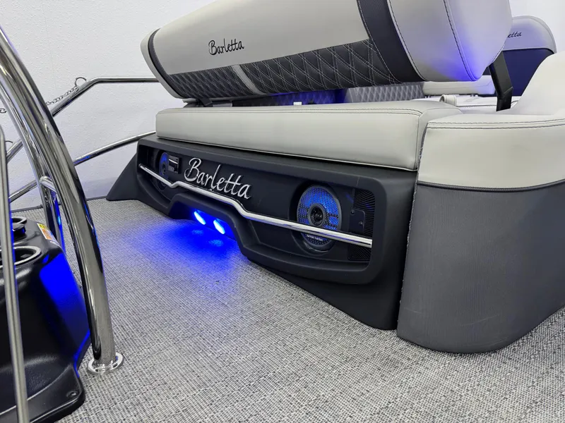 Slide: The Image of 2025 Barletta Reserve Leggera R26UCA boat interior with illuminated speakers and luxury seating. - 9