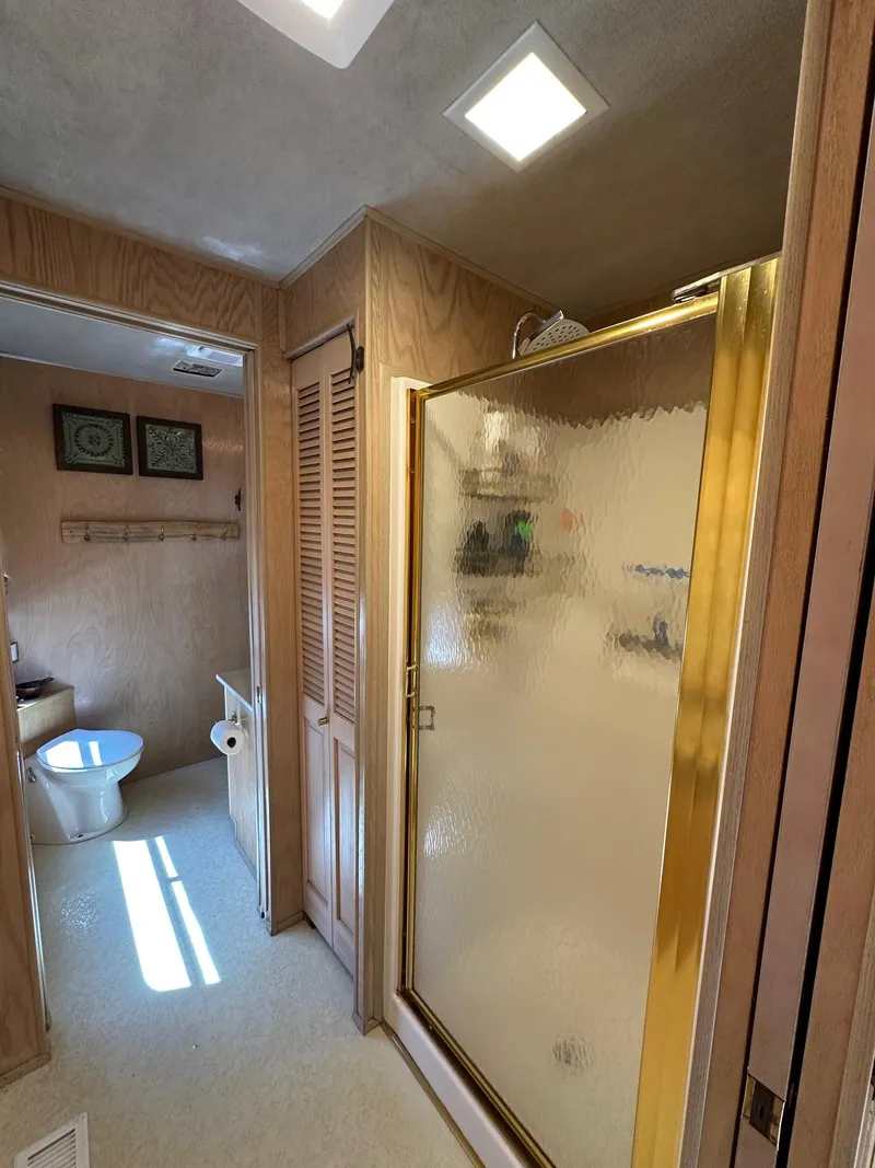 Slide: The Image of Bathroom in 1994 Sumerset 16x73 houseboat with shower and toilet. - 10