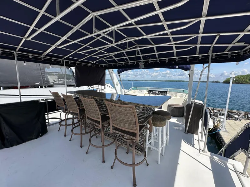 Slide: The Image of Outdoor seating area on a 1994 Sumerset 16x73 houseboat with ocean view. - 15