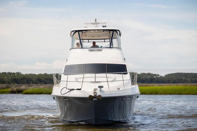 Slide: The Image of 2008 Sea Ray 58 Sedan Bridge yacht cruising on open water. - 1
