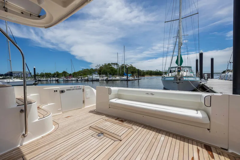 Slide: The Image of 2008 Sea Ray 58 Sedan Bridge yacht with spacious deck at marina. - 12