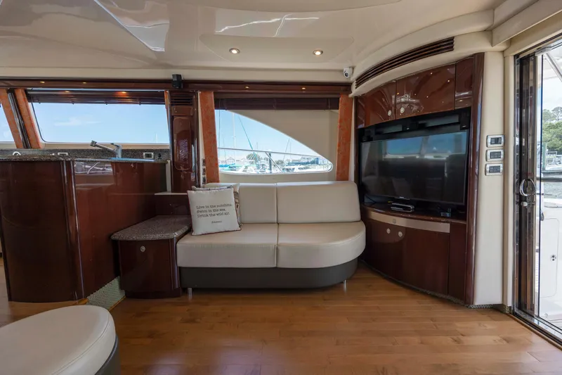 Slide: The Image of Luxurious interior of 2008 Sea Ray 58 Sedan Bridge yacht with modern seating and entertainment system. - 31