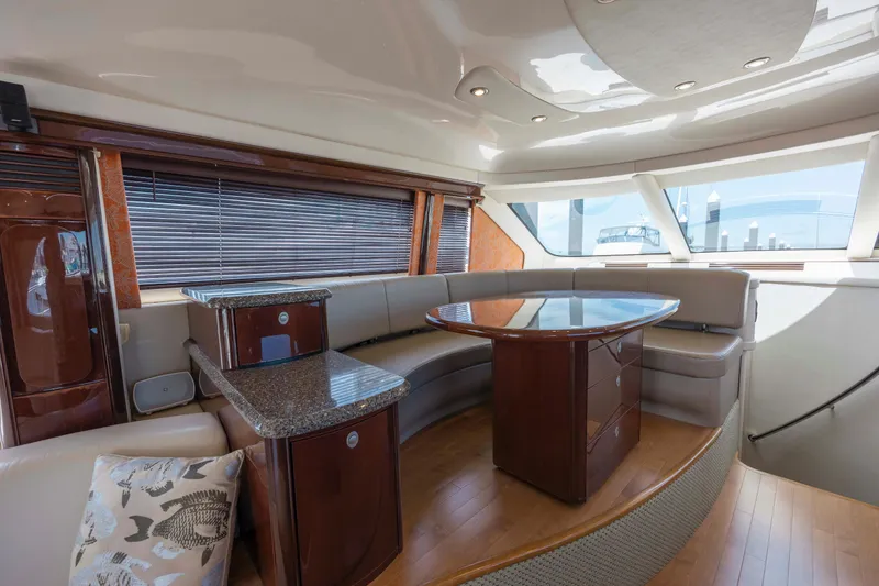 Slide: The Image of Luxurious interior of 2008 Sea Ray 58 Sedan Bridge yacht with elegant seating and table. - 35