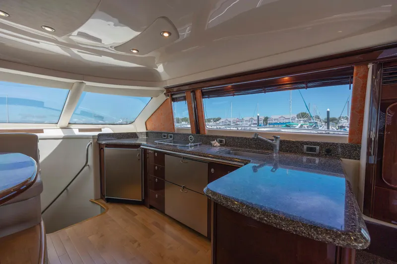 Slide: The Image of Luxurious interior of 2008 Sea Ray 58 Sedan Bridge yacht with modern kitchen amenities. - 37