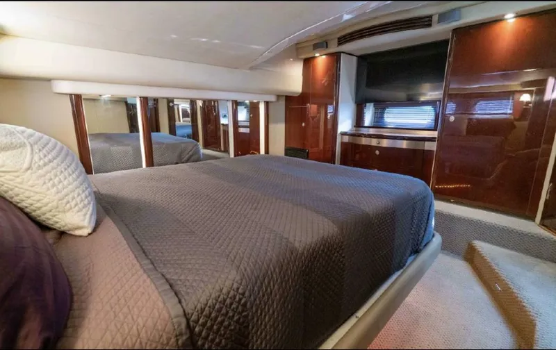 Slide: The Image of Luxurious bedroom interior of 2008 Sea Ray 58 Sedan Bridge yacht with elegant furnishings. - 41