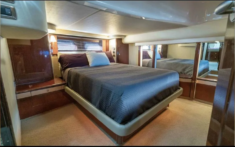 Slide: The Image of Luxurious bedroom interior of 2008 Sea Ray 58 Sedan Bridge yacht with elegant bedding. - 43