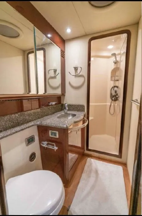 Slide: The Image of Luxurious bathroom in 2008 Sea Ray 58 Sedan Bridge yacht with shower and granite countertop. - 45