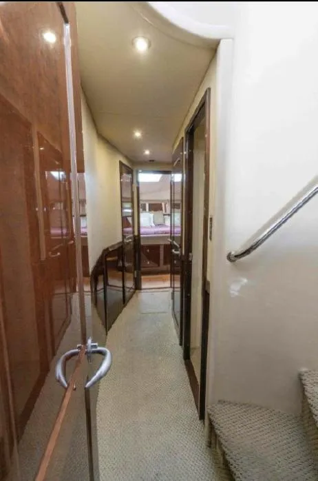 Slide: The Image of Interior hallway of 2008 Sea Ray 58 Sedan Bridge yacht, featuring elegant wood finishes. - 46