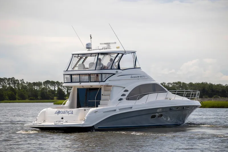 Slide: The Image of 2008 Sea Ray 58 Sedan Bridge yacht cruising on a calm river. - 7