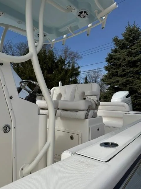 Slide: The Image of 2025 Sea Born LX24 Center Console boat with sleek white interior and modern design. - 22