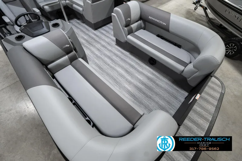 Slide: The Image of 2025 Bennington 21 SLJ pontoon boat interior with gray seating and carpet flooring. - 14