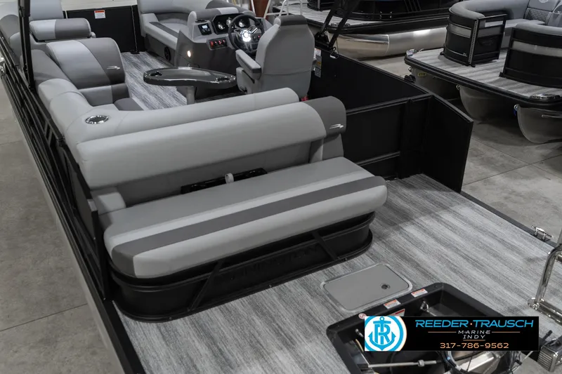 Slide: The Image of 2025 Bennington 21 SLJ pontoon boat interior with gray seating and modern dashboard. - 15