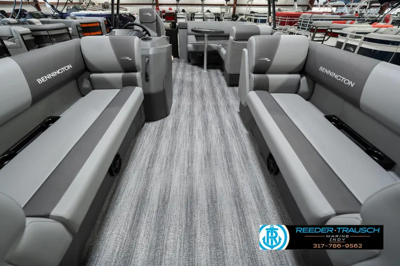 Slide: The Image of 2025 Bennington 21 SLJ pontoon boat interior with gray seating and carpet flooring. - 17