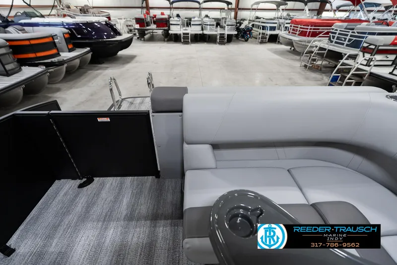 Slide: The Image of 2025 Bennington 21 SLJ pontoon boat interior with gray seating in showroom. - 19