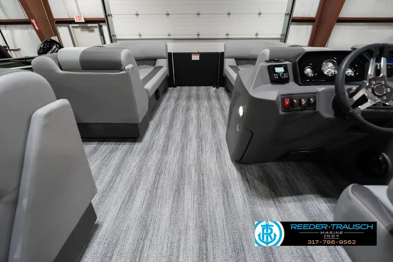 Slide: The Image of Interior of 2025 Bennington 21 SLJ pontoon boat with modern seating and dashboard. - 21