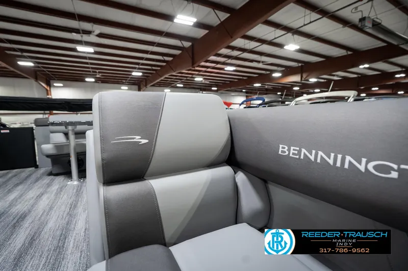 Slide: The Image of 2025 Bennington 21 SLJ boat interior with gray seating in showroom. - 24