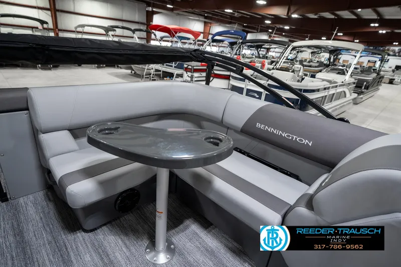 Slide: The Image of 2025 Bennington 21 SLJ pontoon boat interior with gray seating and table. - 26