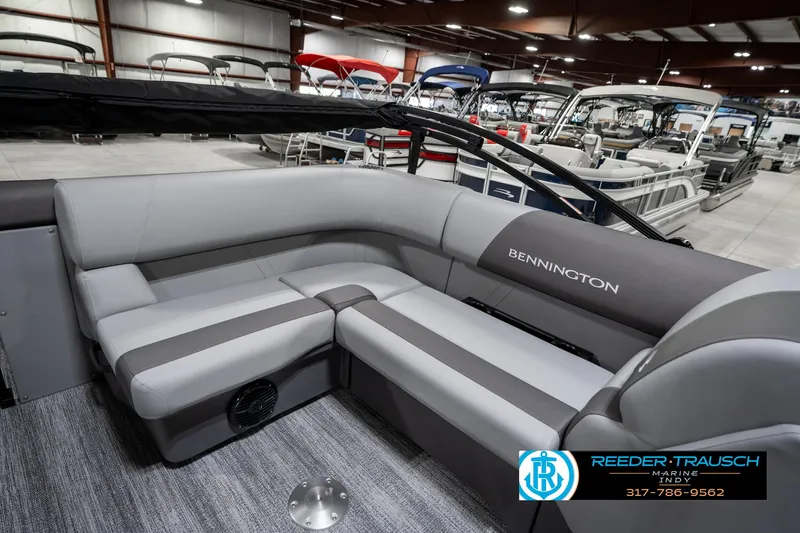 Slide: The Image of 2025 Bennington 21 SLJ pontoon boat interior with gray seating in showroom. - 27