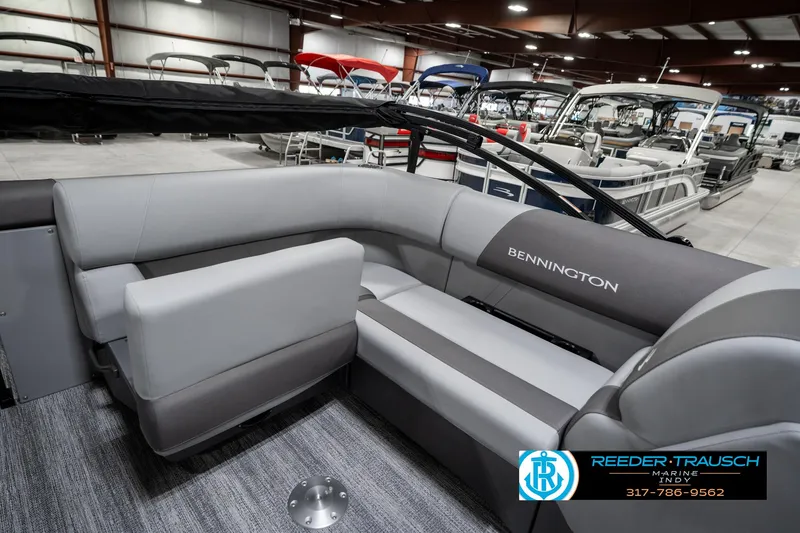 Slide: The Image of 2025 Bennington 21 SLJ pontoon boat interior with gray seating in showroom. - 28