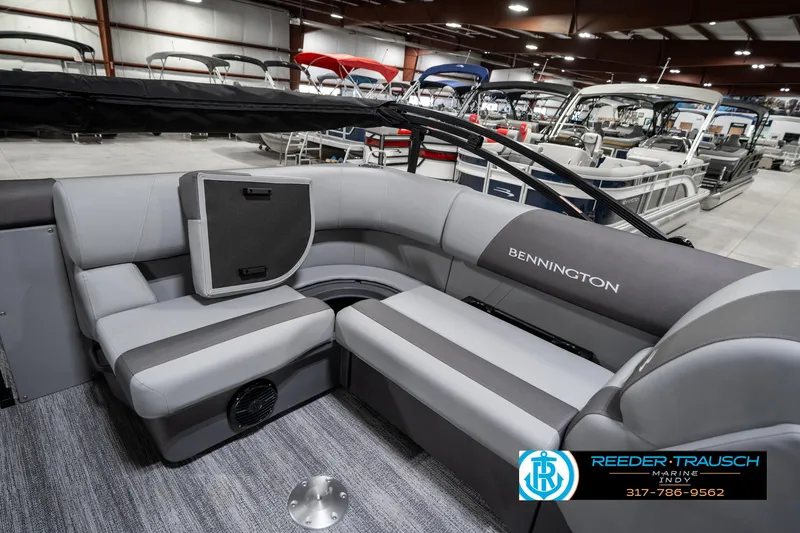 Slide: The Image of 2025 Bennington 21 SLJ pontoon boat interior with gray seating in showroom. - 29