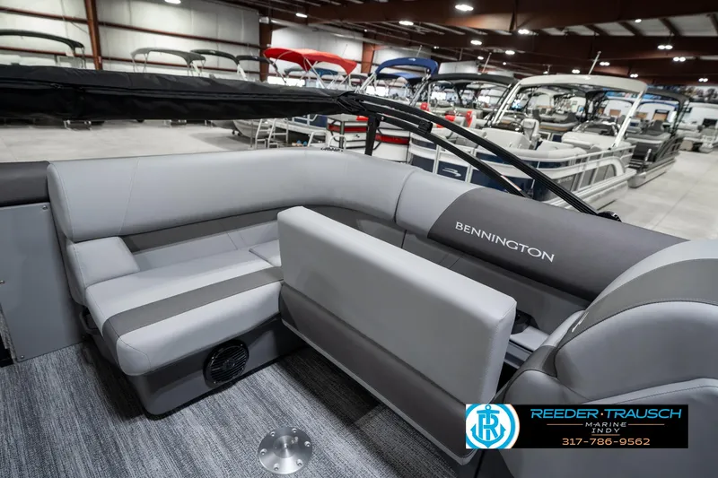 Slide: The Image of 2025 Bennington 21 SLJ pontoon boat interior with gray seating in showroom. - 30