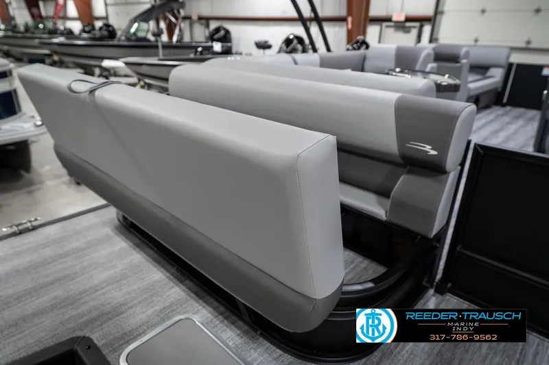 Slide: The Image of 2025 Bennington 21 SLJ boat interior with gray seating in showroom. - 32