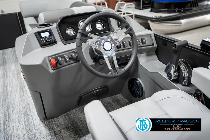 Slide: The Image of 2025 Bennington 21 SLJ boat dashboard with steering wheel and controls. - 34