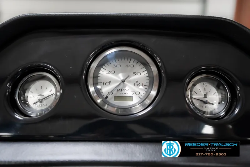 Slide: The Image of Dashboard gauges of 2025 Bennington 21 SLJ boat, featuring RPM and fuel indicators. - 38