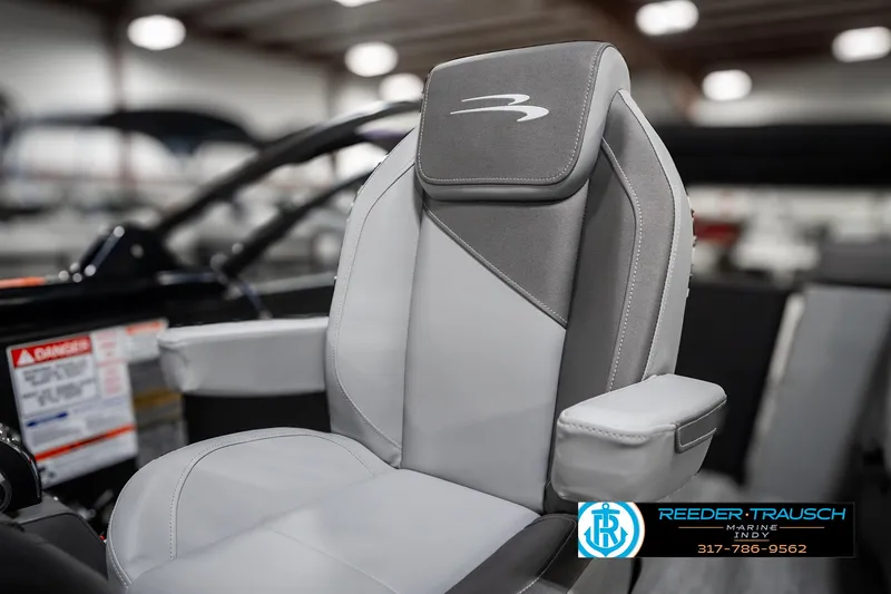 Slide: The Image of 2025 Bennington 21 SLJ boat seat, gray and white upholstery, indoor showroom. - 41