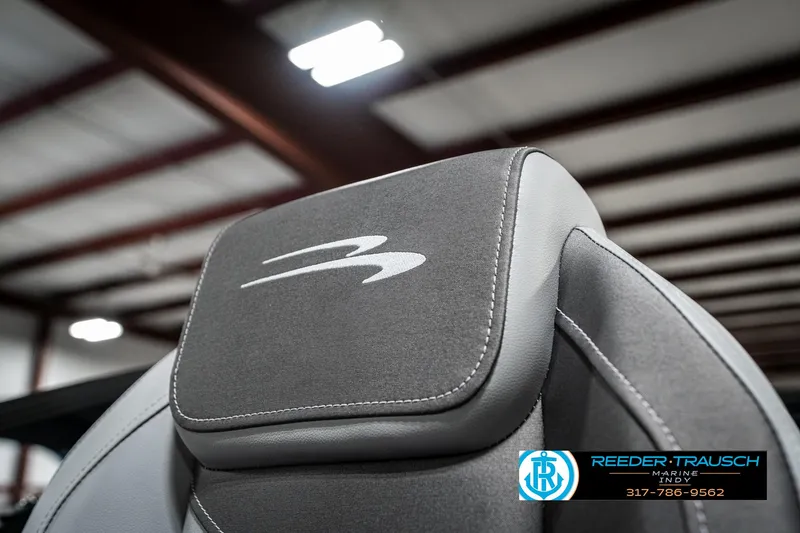 Slide: The Image of 2025 Bennington 21 SLJ boat seat with logo in a showroom setting. - 42