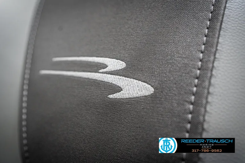 Slide: The Image of 2025 Bennington 21 SLJ logo on gray fabric with Reeder-Trausch Marine branding. - 43