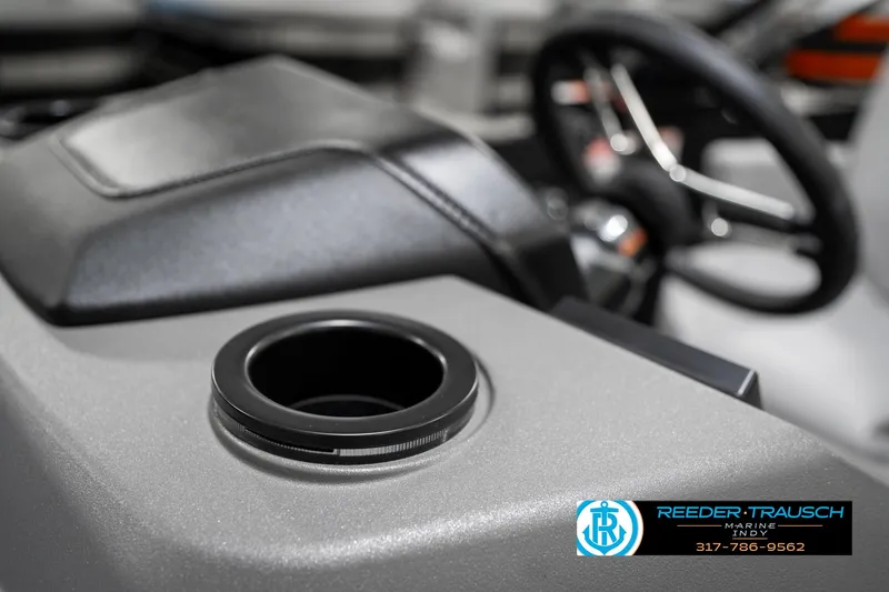 Slide: The Image of 2025 Bennington 21 SLJ boat interior with cup holder and steering wheel. - 46