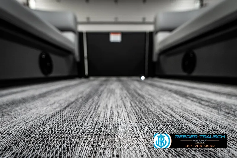 Slide: The Image of 2025 Bennington 21 SLJ interior flooring with modern design, featuring Reeder-Trausch Marine branding. - 48