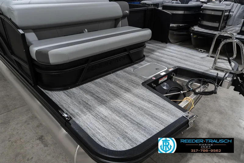 Slide: The Image of 2025 Bennington 21 SLJ pontoon boat with gray seating and deck, featuring a swim ladder. - 49
