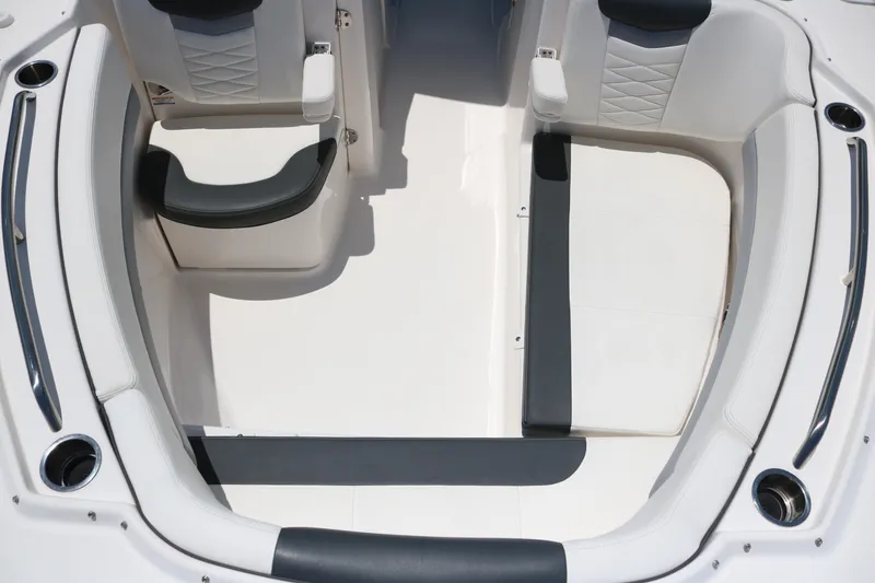 Slide: The Image of 2023 Robalo R317 boat interior with cushioned seating and sleek design. - 14