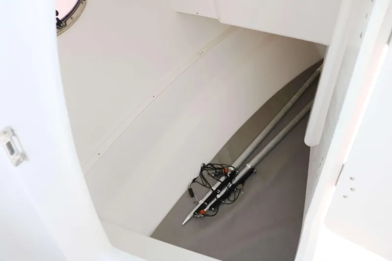 Slide: The Image of 2023 Robalo R317 boat interior storage compartment with equipment. - 18