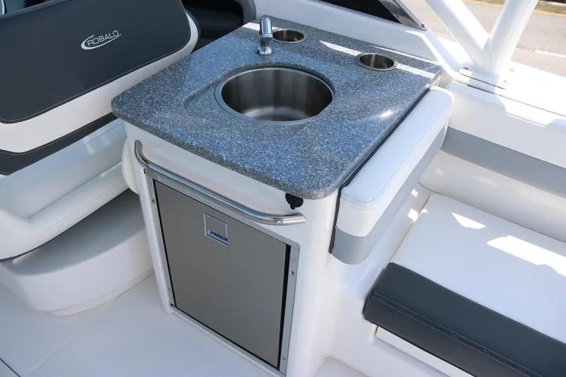 Slide: The Image of 2023 Robalo R317 boat interior with sink and storage area. - 19