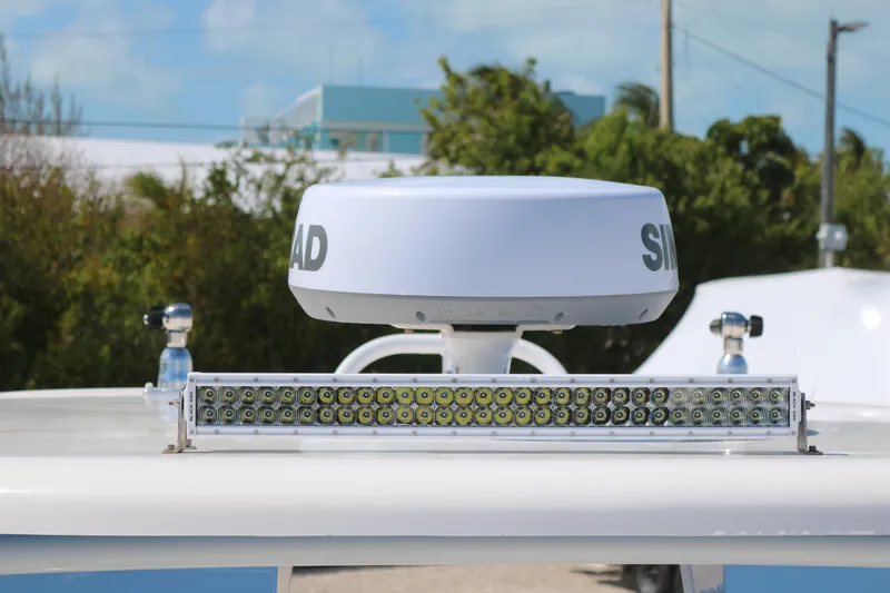 Slide: The Image of 2023 Robalo R317 boat radar and LED light bar against a clear sky. - 9