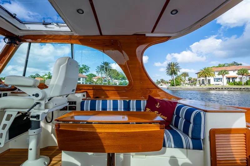 Slide: The Image of 2017 Hinckley Picnic Boat 37 MKIII interior with elegant seating and waterfront view. - 10