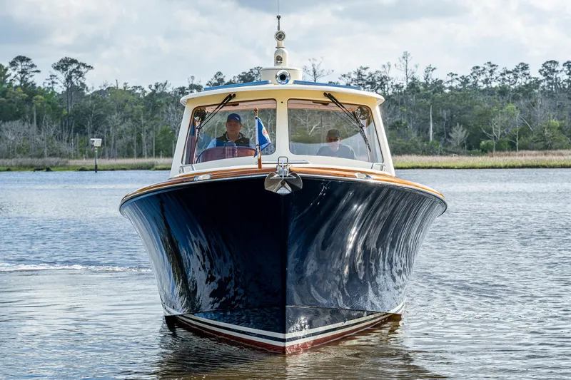Slide: The Image of 2017 Hinckley Picnic Boat 37 MKIII cruising on a calm waterway. - 2