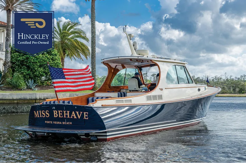 The Image of 2017 Hinckley Picnic Boat 37 MKIII on water, American flag, "Miss Behave" nameplate. - 0