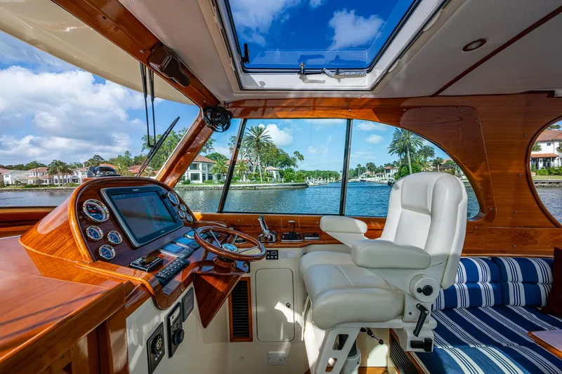 Slide: The Image of Interior of 2017 Hinckley Picnic Boat 37 MKIII with luxurious helm and waterfront view. - 11